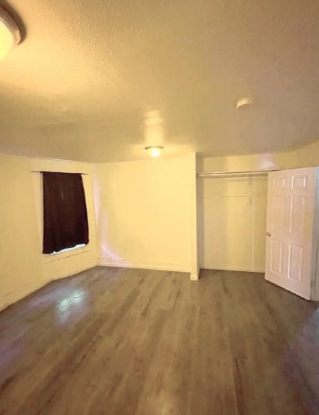 409 West 17th Street, Unit 3 San Bernardino, CA 92405 - Photo 1 of 5 a view of an empty room with wooden floor