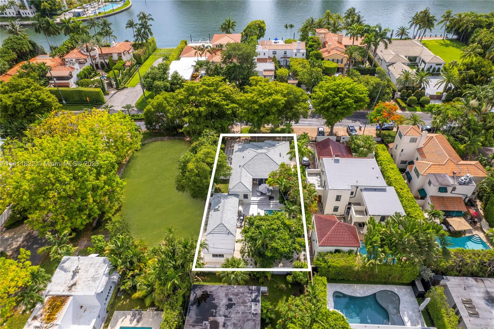 5956 Pine Tree Drive Miami Beach, FL 33140 - Photo 15 of 55 an aerial view of lake houses with outdoor space