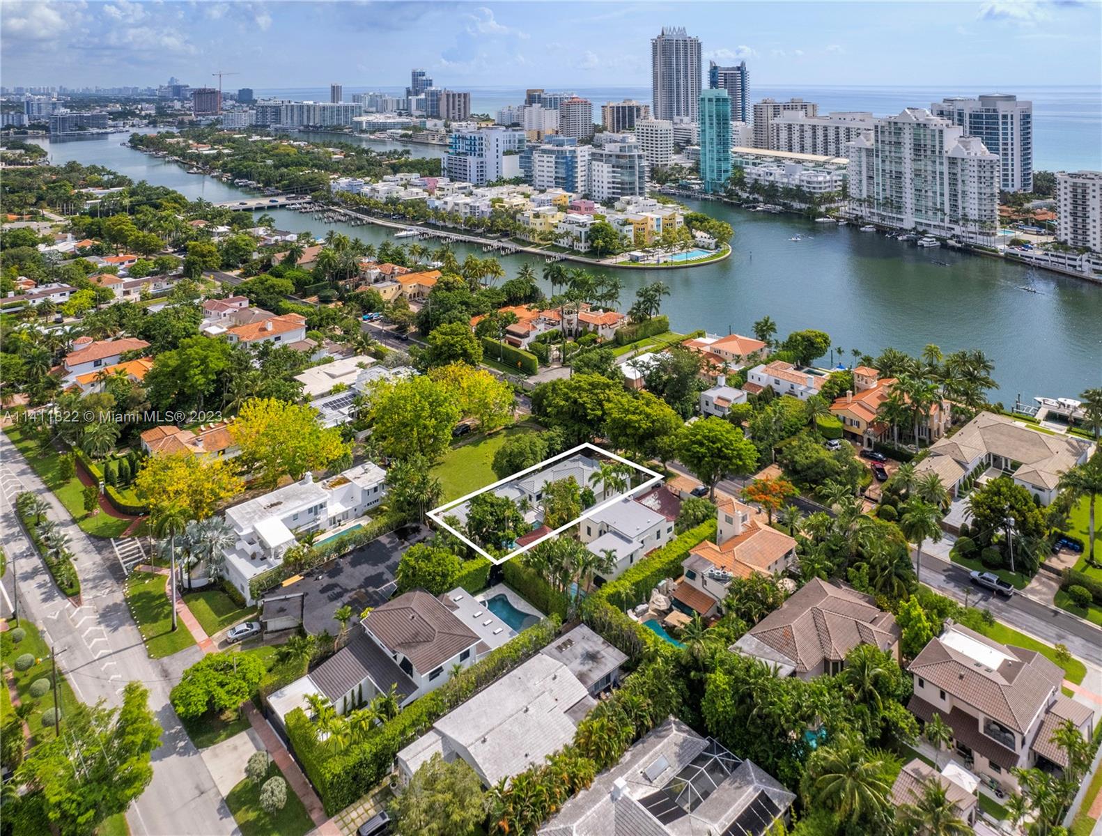 5956 Pine Tree Drive Miami Beach, FL 33140 - Photo 16 of 55 aerial view of a city with lake