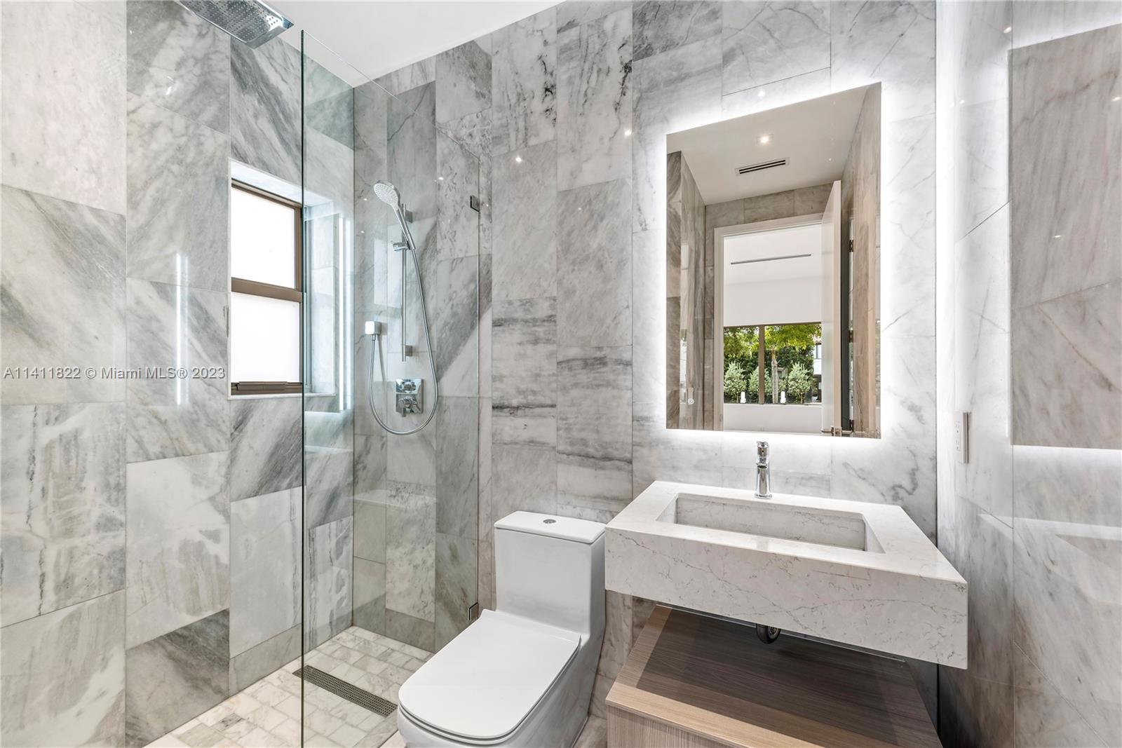 5956 Pine Tree Drive Miami Beach, FL 33140 - Photo 30 of 55 a bathroom with a sink toilet and shower