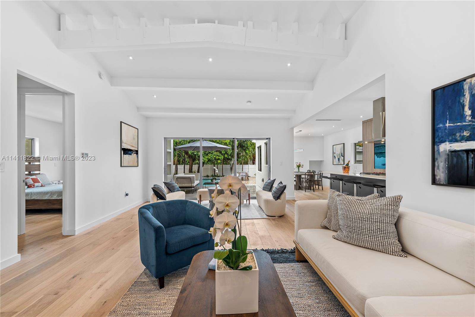 5956 Pine Tree Drive Miami Beach, FL 33140 - Photo 3 of 55 a living room with furniture and a large window