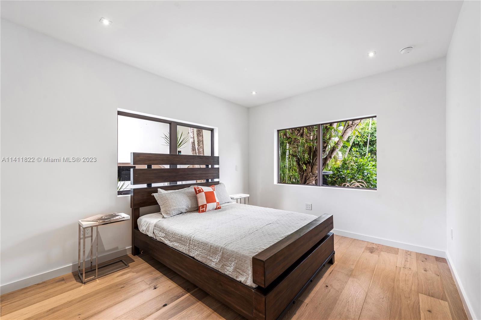 5956 Pine Tree Drive Miami Beach, FL 33140 - Photo 31 of 55 a bed room with a bed and a window