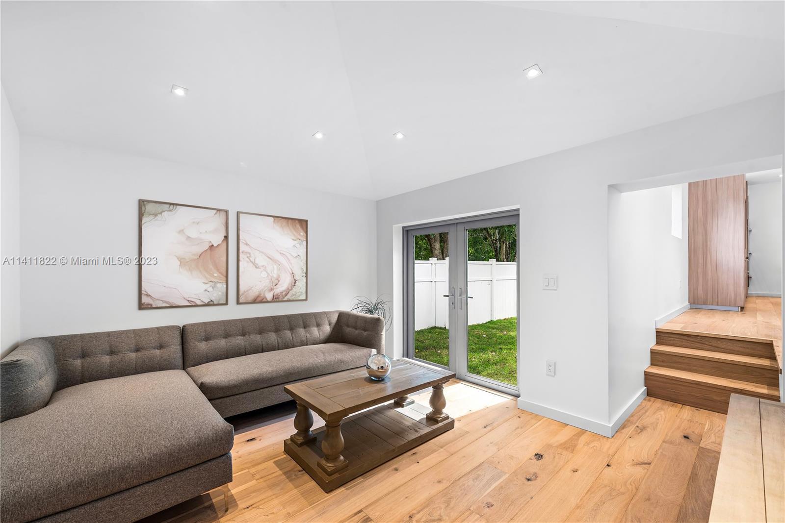 5956 Pine Tree Drive Miami Beach, FL 33140 - Photo 34 of 55 a living room with furniture and a window