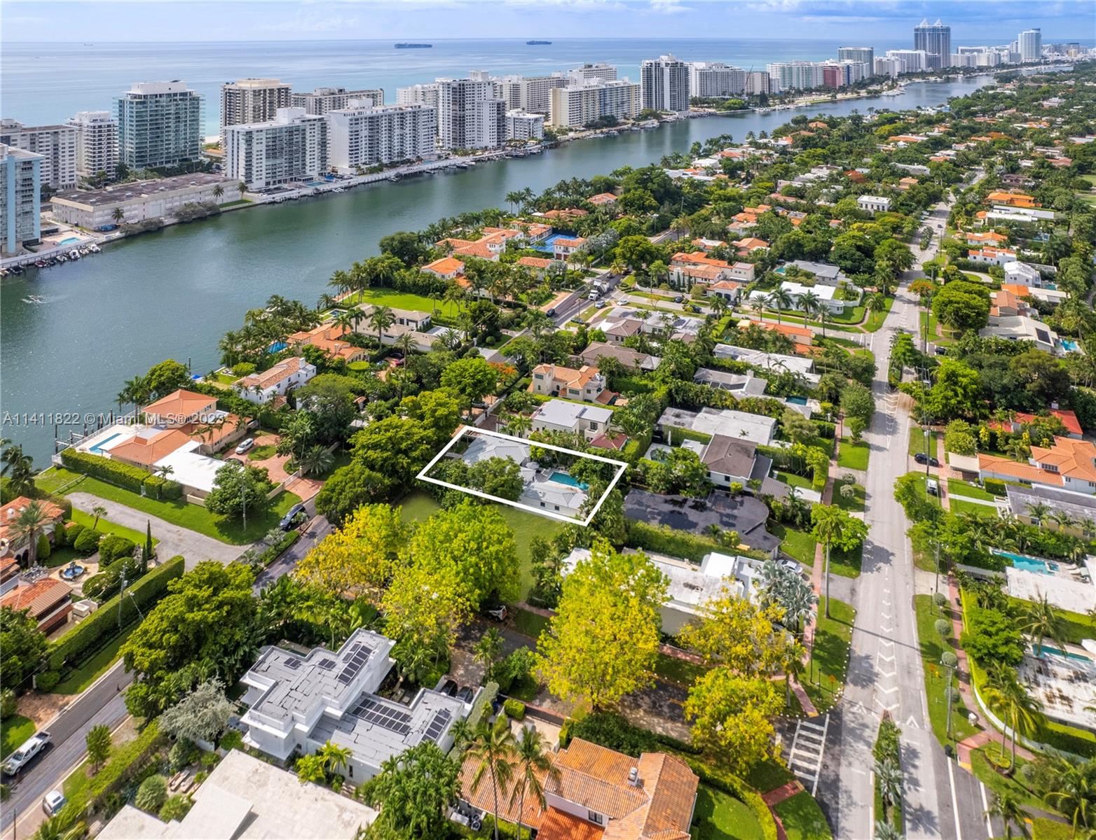 5956 Pine Tree Drive Miami Beach, FL 33140 - Photo 47 of 55 an aerial view of residential houses with outdoor space and lake view