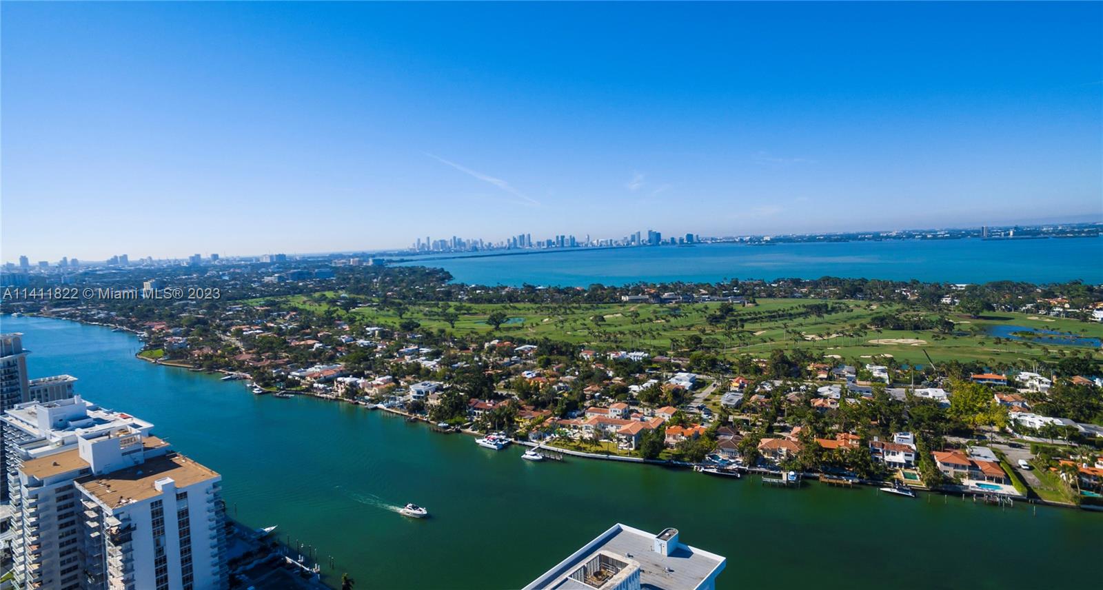 5956 Pine Tree Drive Miami Beach, FL 33140 - Photo 48 of 55 an aerial view of lake and residential houses with outdoor space