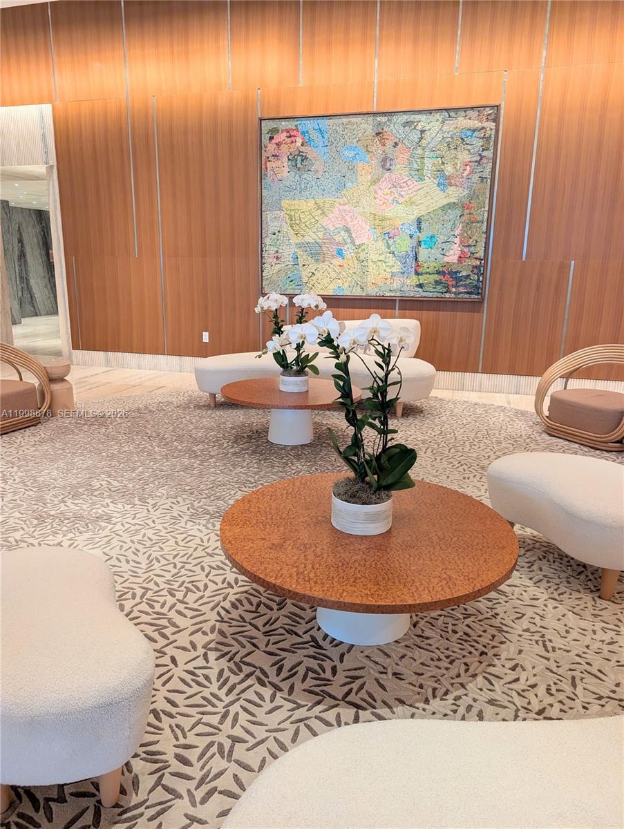 500 Alton Road, Unit 3905 Miami Beach, FL 33139 - Photo 15 of 27 a living room with furniture and a flat screen tv