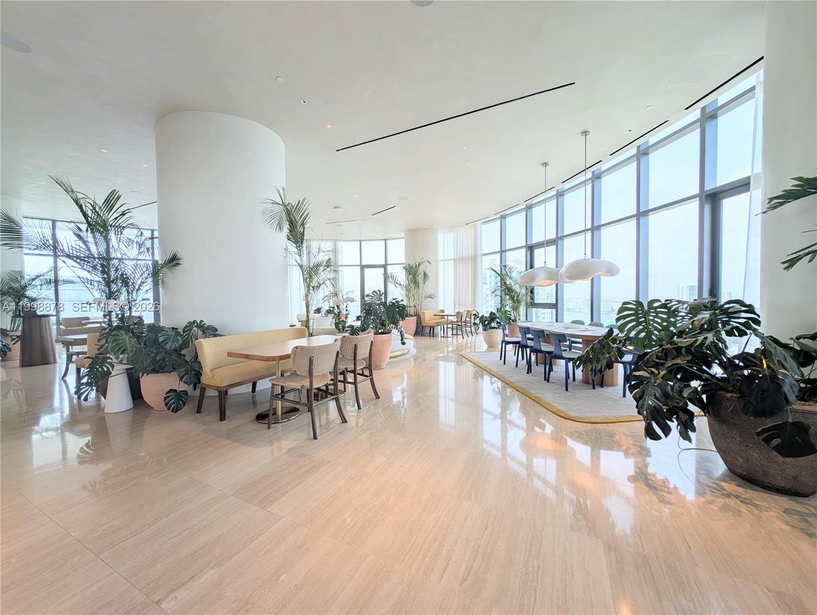 500 Alton Road, Unit 3905 Miami Beach, FL 33139 - Photo 24 of 27 a dinning area with furniture and a large window