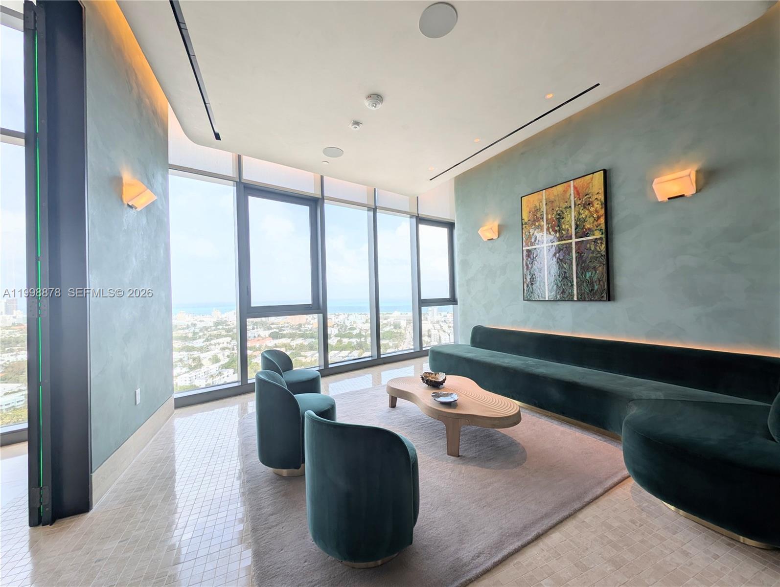 500 Alton Road, Unit 3905 Miami Beach, FL 33139 - Photo 26 of 27 a living room with furniture and large windows