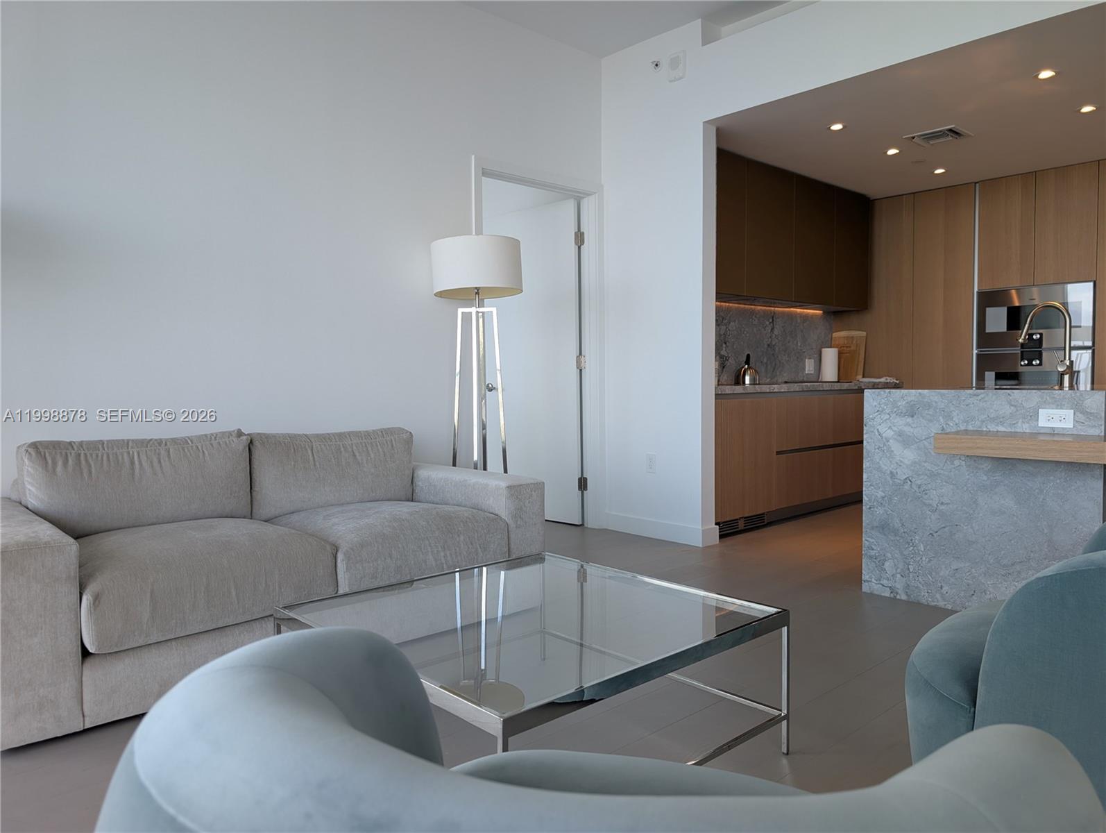 500 Alton Road, Unit 3905 Miami Beach, FL 33139 - Photo 7 of 27 a living room with furniture and a couch