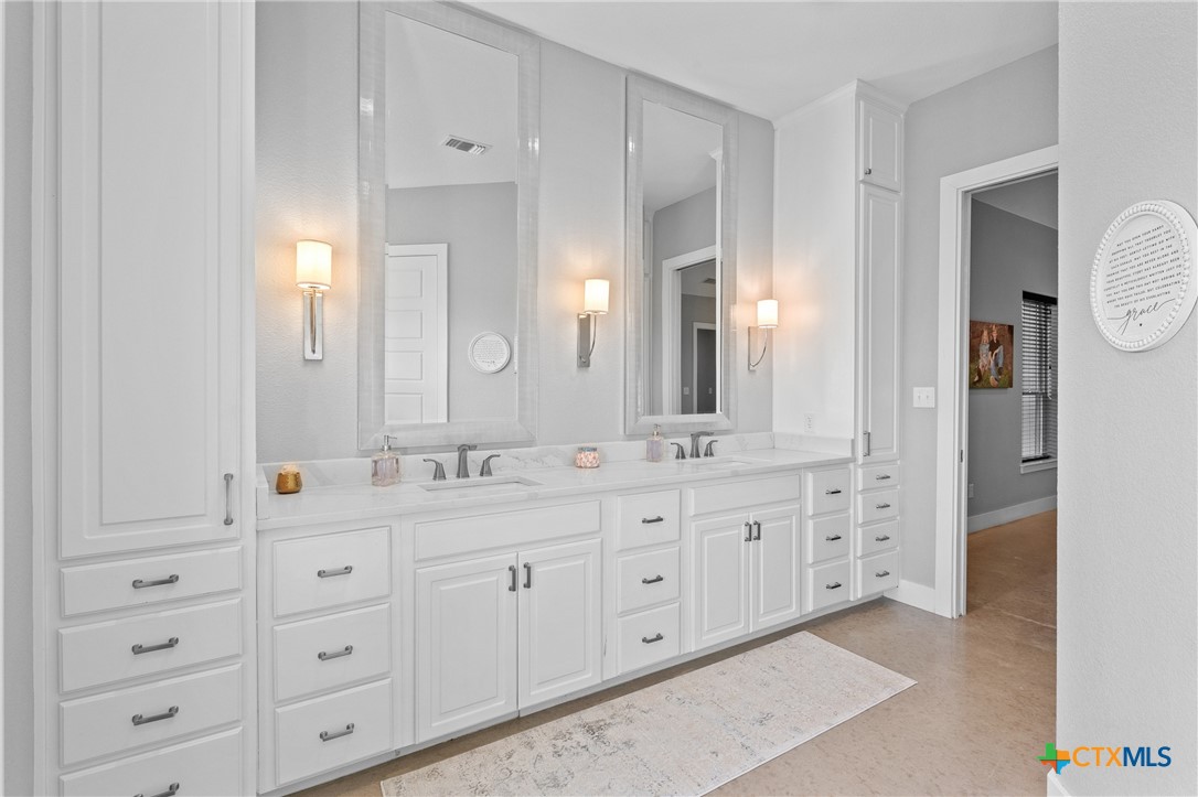 7351 Hackberry Road Holland, TX 76534 - Photo 15 of 41 a spacious bathroom with double sink and a mirror