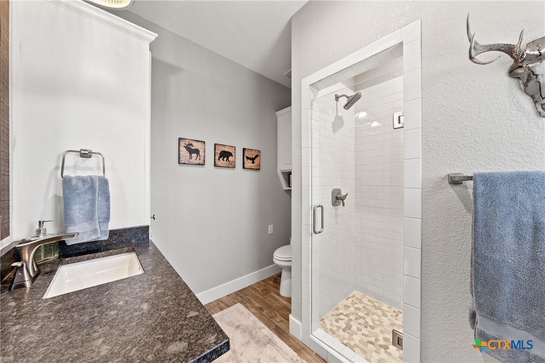 7351 Hackberry Road Holland, TX 76534 - Photo 24 of 41 a bathroom with a sink and shower