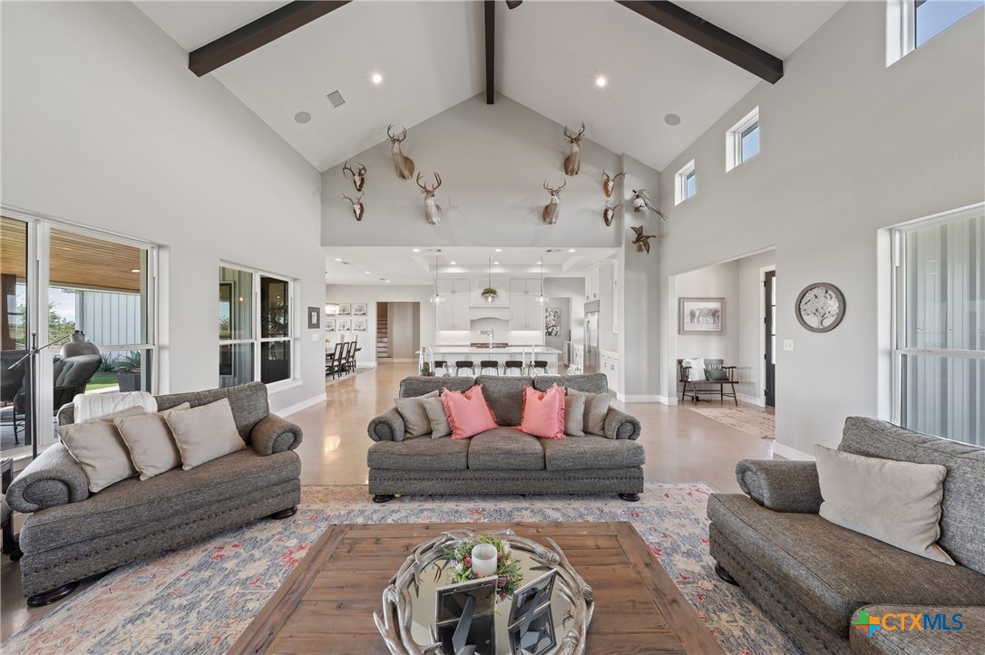 7351 Hackberry Road Holland, TX 76534 - Photo 6 of 41 a living room with furniture and a chandelier