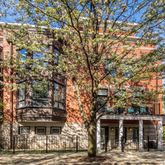 a view of a building with a tree