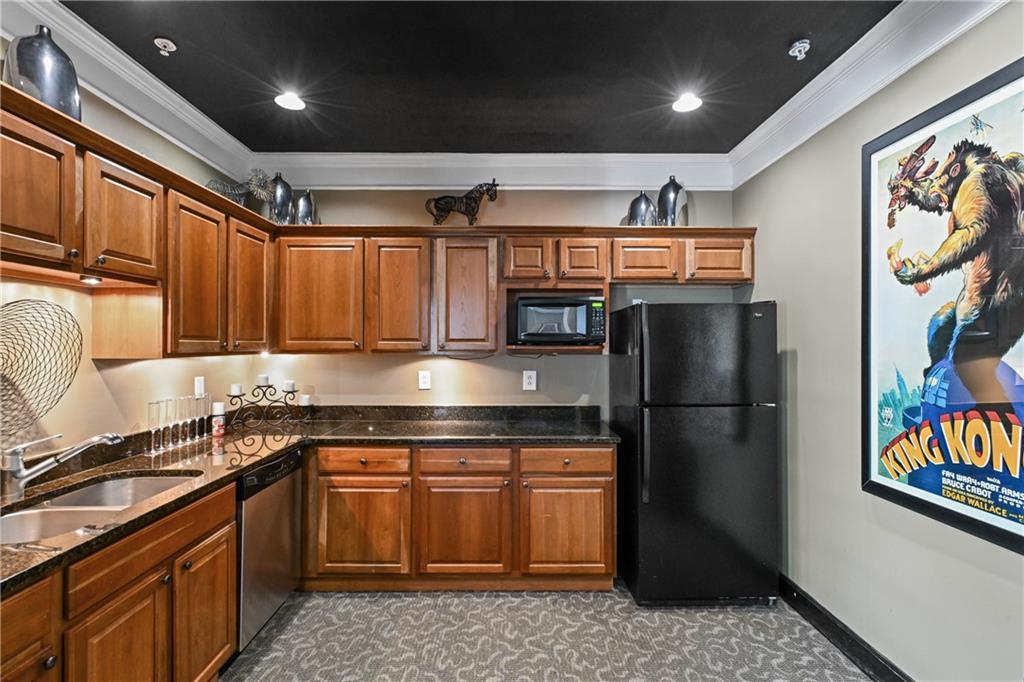 10 Perimeter Summit Boulevard, Unit 3311 Atlanta, GA 30319 - Photo 41 of 68 a kitchen with stainless steel appliances granite countertop a refrigerator and a sink