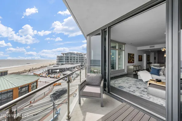 a view of a balcony with table and chairs