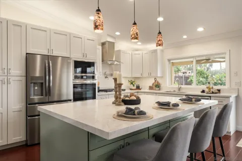 a kitchen with a dining table and chairs