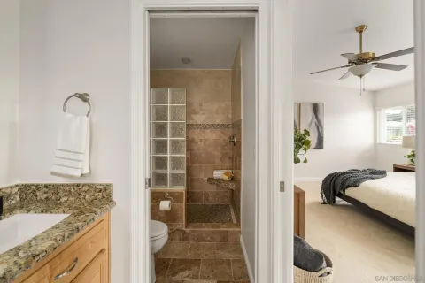a en suite bathroom with a sink and a shower