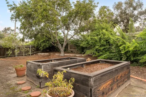 a view of a backyard with sitting area