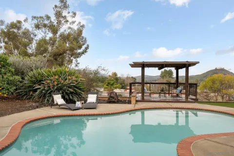 a balcony with furniture and a table