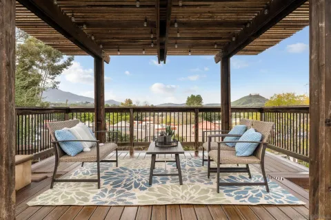 a roof deck with outdoor seating