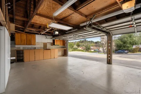 a view of empty room with wooden walls