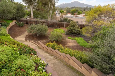 a view of a garden with a lake view