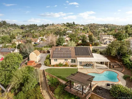 an aerial view of a house with a garden
