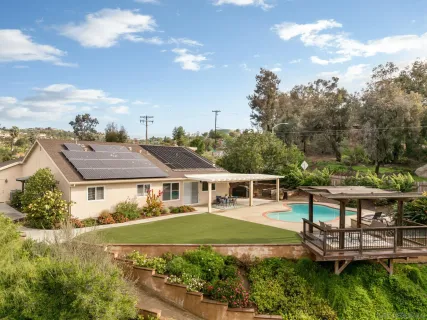 an aerial view of a house with garden view