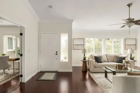 a living room with furniture and a large window