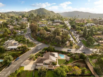 an aerial view of residential houses with outdoor space