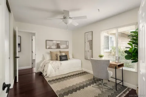 a bedroom with a large bed and a window