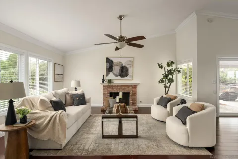 a living room with furniture fireplace and window