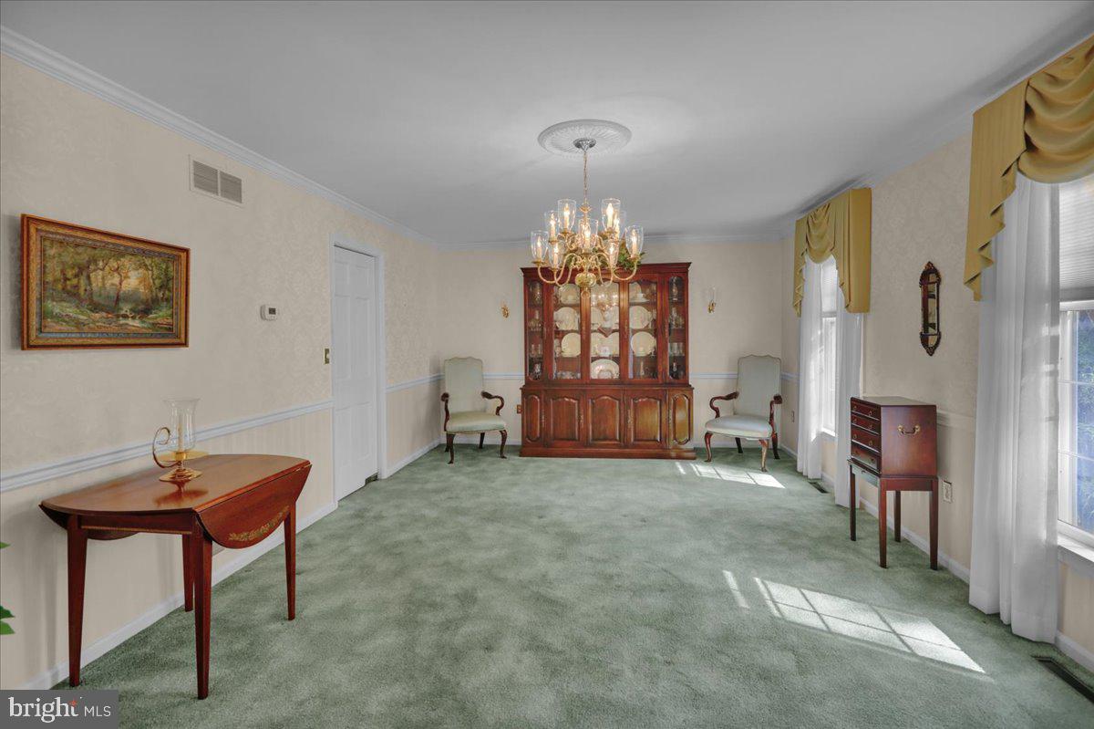 22 Lisa Road Sinking Spring, PA 19608 - Photo 19 of 60 a living room with furniture and a chandelier