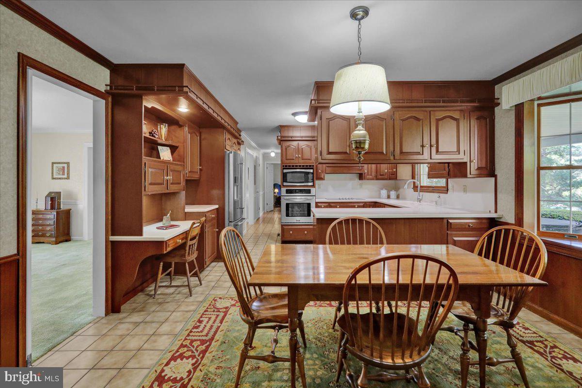 22 Lisa Road Sinking Spring, PA 19608 - Photo 25 of 60 a dining room with furniture a chandelier and window