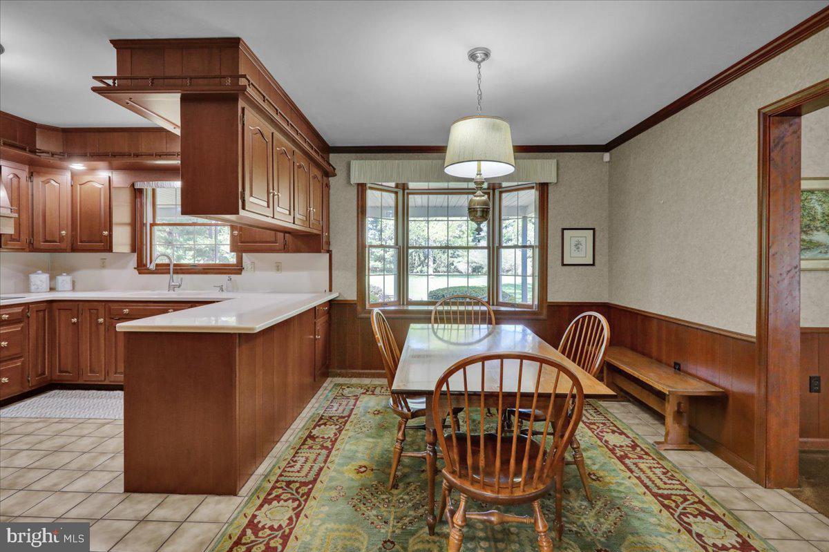 22 Lisa Road Sinking Spring, PA 19608 - Photo 26 of 60 a view of a dining room with furniture a chandelier and wooden floor