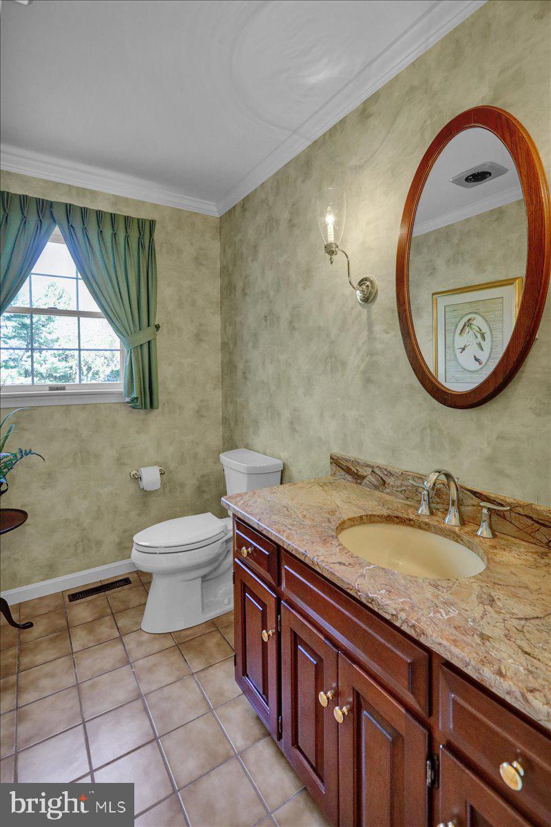 22 Lisa Road Sinking Spring, PA 19608 - Photo 30 of 60 a bathroom with a granite countertop sink and a mirror
