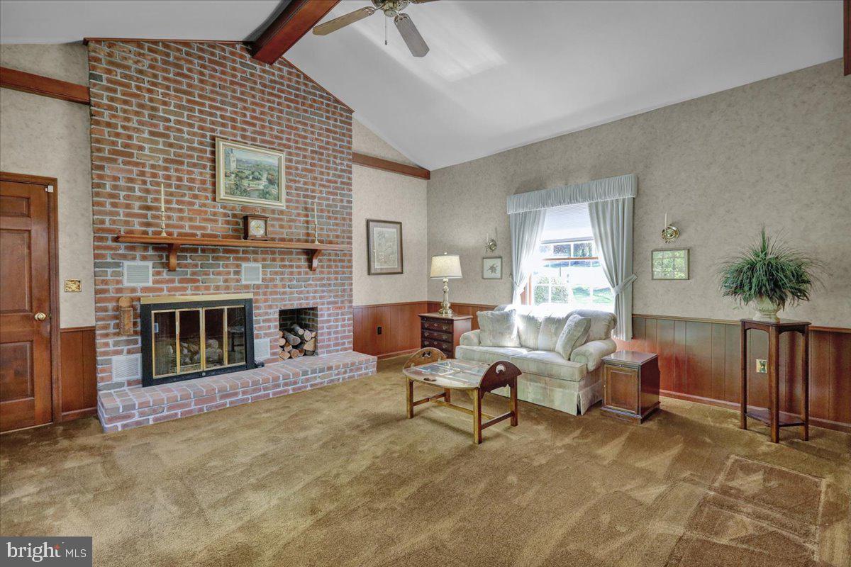 22 Lisa Road Sinking Spring, PA 19608 - Photo 34 of 60 a living room with furniture and a fireplace