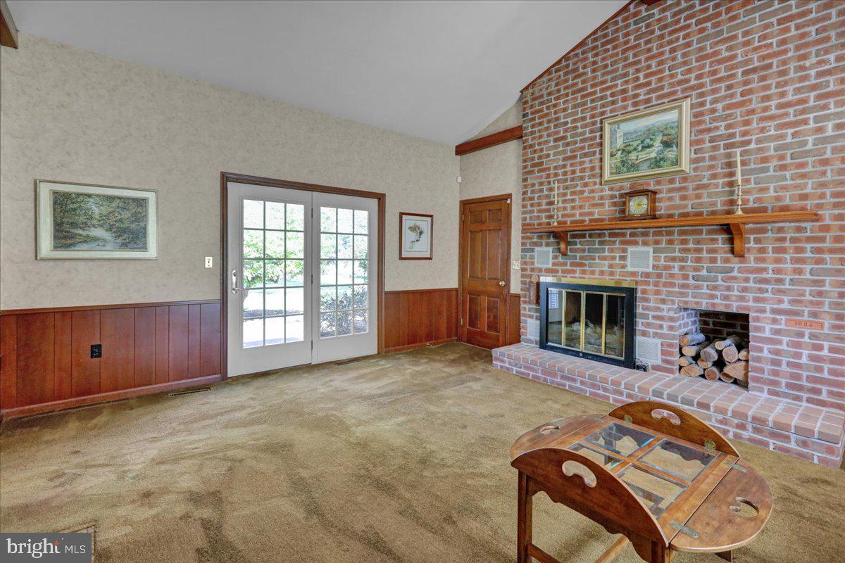 22 Lisa Road Sinking Spring, PA 19608 - Photo 35 of 60 a living room with furniture and a fireplace