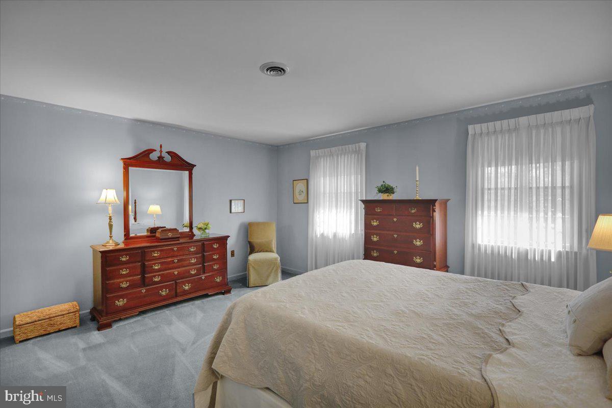 22 Lisa Road Sinking Spring, PA 19608 - Photo 43 of 60 a bedroom with a bed dresser and mirror