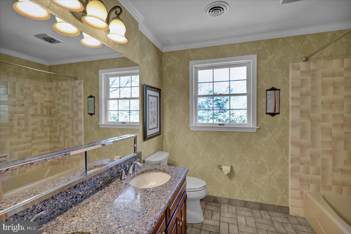 22 Lisa Road Sinking Spring, PA 19608 - Photo 45 of 60 a bathroom with a granite countertop sink mirror vanity and a bathtub