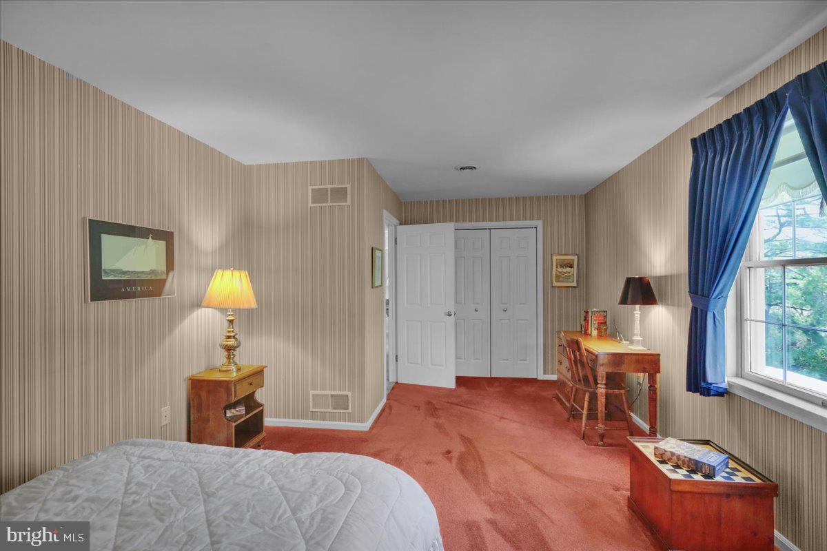 22 Lisa Road Sinking Spring, PA 19608 - Photo 48 of 60 a bedroom with a bed and a lamp