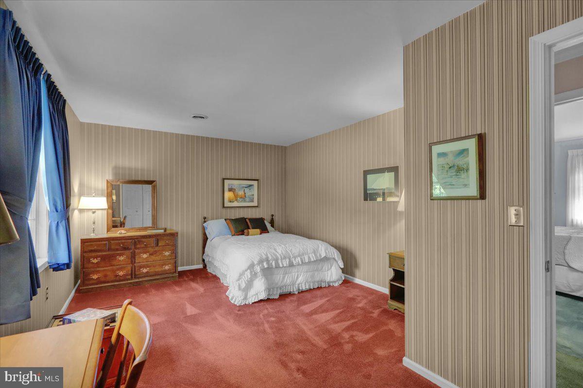 22 Lisa Road Sinking Spring, PA 19608 - Photo 49 of 60 a bedroom with a bed and furniture