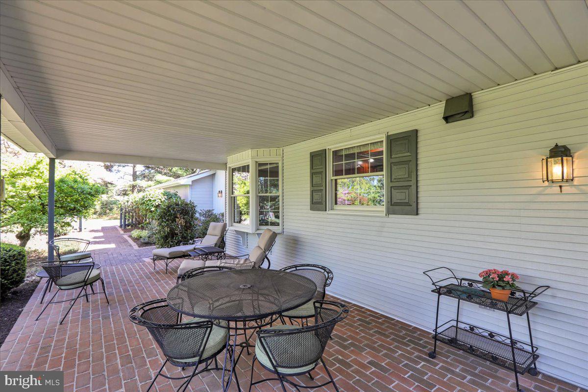 22 Lisa Road Sinking Spring, PA 19608 - Photo 8 of 60 a outdoor dining space with furniture and wooden floor