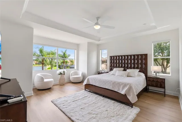 a bedroom with furniture and a flat screen tv