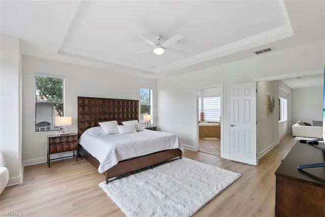a bathroom with a granite countertop sink mirror and bathtub