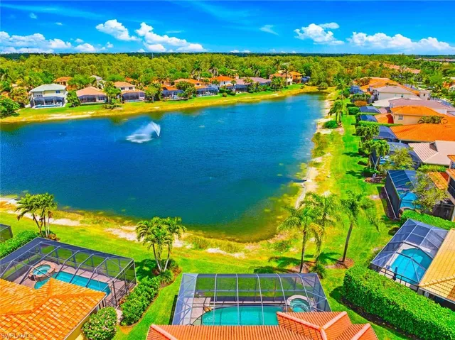 a aerial view of a house with a yard basket ball court