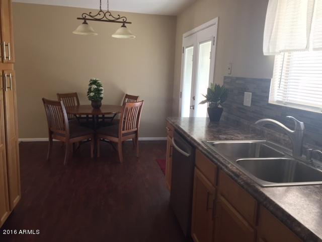 15215 North Ridgeview Road Sun City, AZ 85351 - Photo 8 of 22 kichen looking into dining