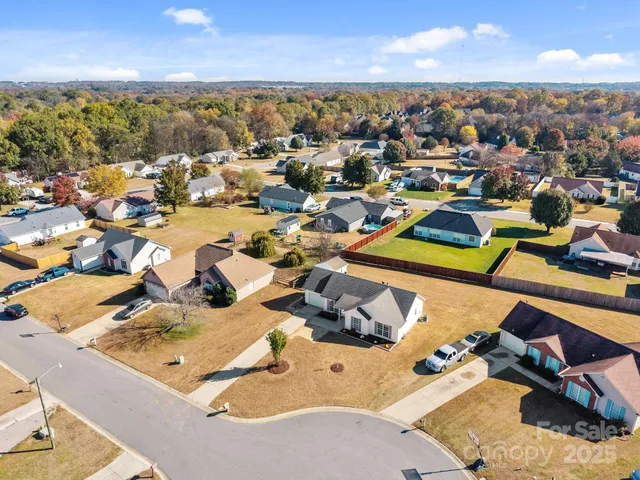 an aerial view of a houses with outdoor space