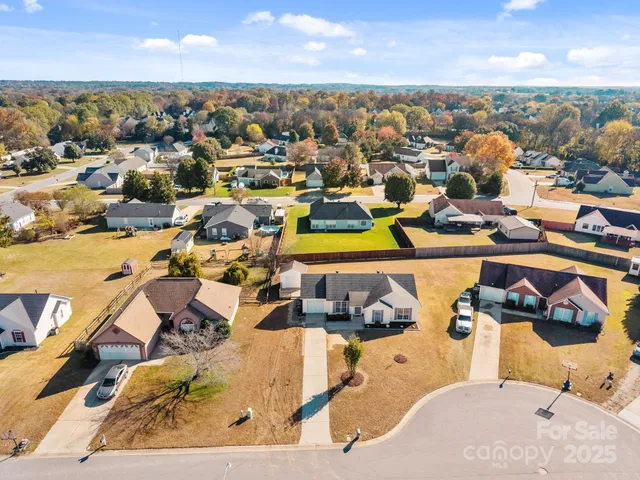 an aerial view of a house with a ocean view