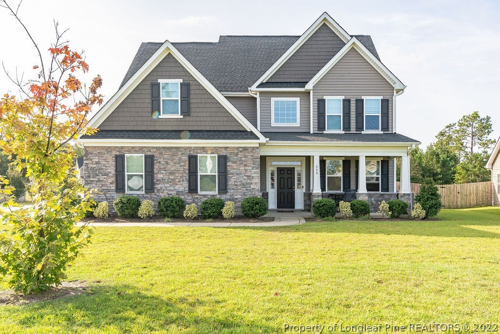 335 Turriff Way Cameron, NC 28326 - Photo 2 of 50 a front view of a house with a yard